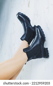 Close Up Of Female Legs In Black Leather Boots. New Autumn Collection Of Women's Leather Shoes 2022