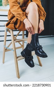 Close Up Of Female Legs In Black Leather Boots. Women's Autumn Shoes.