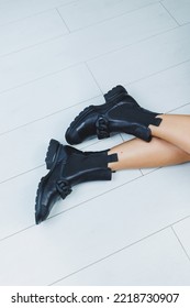 Close Up Of Female Legs In Black Leather Boots. Women's Autumn Shoes.