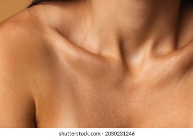 Close up female neck, collarbones isolated on pink studio background. Beautiful caucasian woman with well-kept skin. Natural beauty, fitness, diet, spa, plastic surgery and aesthetic cosmetology