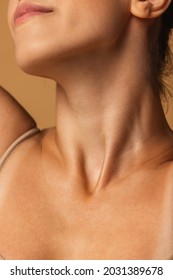 Close up female neck, collarbones isolated on pink studio background. Beautiful caucasian woman with well-kept skin. Natural beauty, fitness, diet, spa, plastic surgery and aesthetic cosmetology