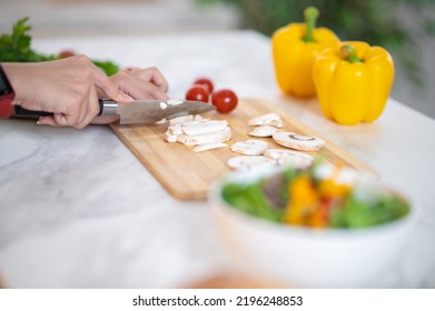 Close Up Of Females Hands Cutting Veggies