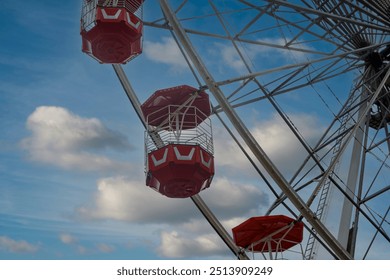 Close up of a ferris wheel with a blue sky background - Powered by Shutterstock