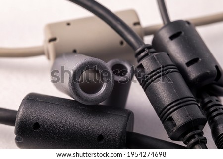 Close up of a ferrite bead inductor. An electrical element that suppresses high-frequency electronic noise in electronic circuits.