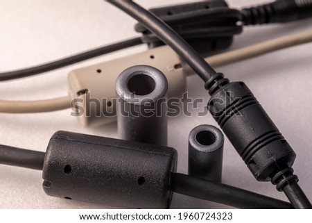 Close up of a ferrite bead inductor. An electrical element that suppresses high-frequency electronic noise in electronic circuits.