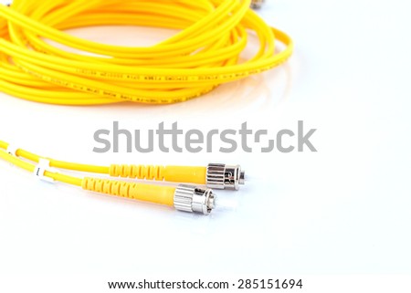 Close up of a fiber optic patchcord over white background