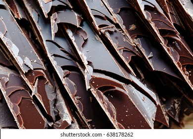 Close up of fine chocolate chopped by hand, sliced off the block with a knife. - Powered by Shutterstock