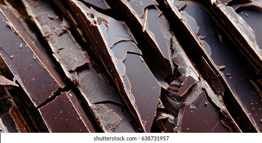 Close up of fine chocolate chopped by hand, sliced off the block with a knife. - Powered by Shutterstock