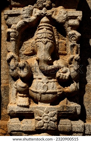 Close of finely carved Ganesha in seated pose.