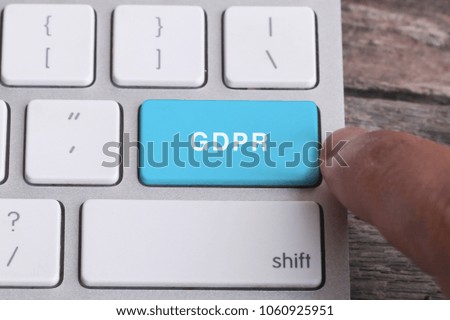 Close up of finger on keyboard button with GDPR  word