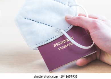 Close Up Of Fingers Holding A Passport For Travelling, Airport, “Reisepass Passport”, Ffp2 Protection Mask