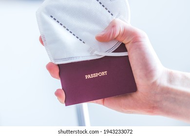 Close Up Of Fingers Holding A Passport For Travelling, Airport, “passport”, Ffp2 Protection Mask