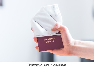 Close Up Of Fingers Holding A Passport For Travelling, Airport, “Reisepass Passport”, Ffp2 Protection Mask