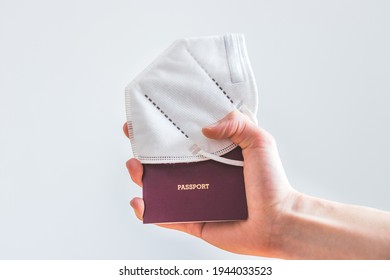 Close Up Of Fingers Holding A Passport For Travelling, Airport, “passport”, Ffp2 Protection Mask