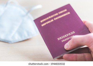 Close Up Of Fingers Holding A Passport For Travelling, Airport, “Reisepass Passport”, Ffp2 Protection Mask