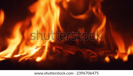 close up of fire flame burning a bonfire or fireplace at home