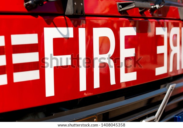 Close up of FIRE sign on the front of a British\
fire engine.