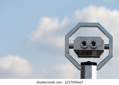 Close Up Of Fixed Telescope Binocular Scope At Viewpoint Against Partly Cloudy Blue Sky As Concept For Landmarks And Lookouts