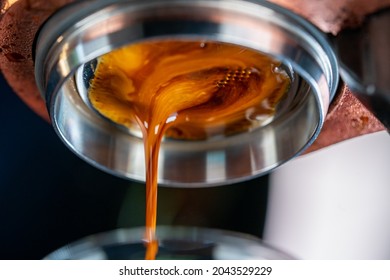 Close up of Flair espresso coffee machine pouring hot espresso shot in coffee cup. Barista brewing black coffee at coffee shop in the morning. Small business cafe restaurant food and drink concept - Powered by Shutterstock