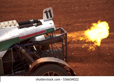 Close Up Of Flame From Racing Car Exhaust. Rallycross Buggy Car With Flame From Exhaust. Unburned Fuel Get On Fire. 