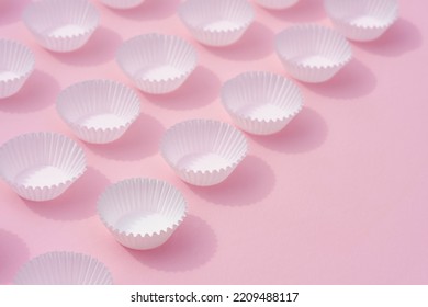 Close Up Flat Lay Soft Light Empty White Paper Round Cupcake Containers On Sweet Pink Minimal Background.idea For Dessert Backdrop,bakery Supplies Shop Wallpaper.