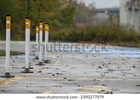 close up of flexible delineator posts in parking lot 