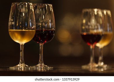 Close Up Of A Flight Of Wine Glasses With Different Wines Set Up For A Wine Tasting In Porto Portugal At A Winery