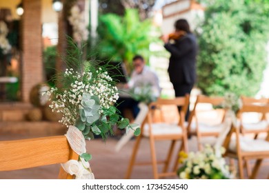 Close Up Of A Flower Decoration Of A Wedding Ceremony Before Guests Arrive. 