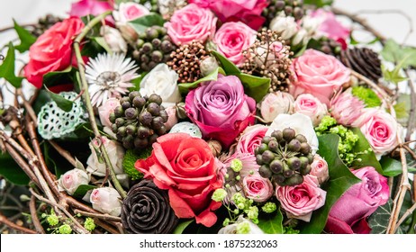 Close Up Flower Pattern. Funeral Ikebana Wreath In The Shape Of The Heart Isolated On A White Background. Made Of Pink, Coral, White Roses.