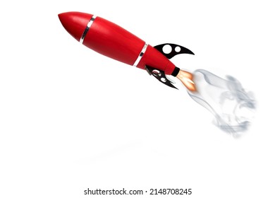 Close Up Of A Flying Red Toy Kids Baby Rocket With Fire And Steam After Ignition And Black Supports On White Background