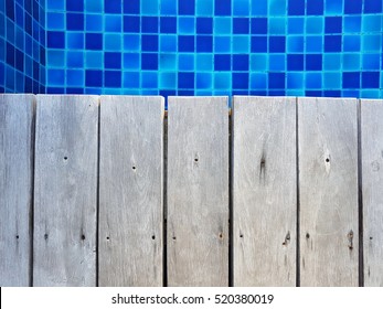 Close Focus Of Edge Of Wood Floor Near Swimming Pool. Top View.