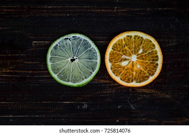 Close focus of hand holding sweet oranges and lemon cut off with copy space for text or advertising