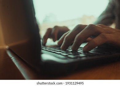 Close focus of man's hands typing. Man working at home office hand on keyboard close up. Selective focus. - Powered by Shutterstock