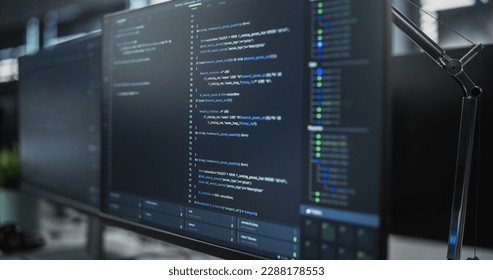 Close Up Focus on Desktop Computer Screen. Digital Display Showing Coding Language User Interface. Software Engineer Programming Innovative e-Commerce Software in Office