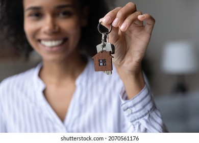  Close Up Focus On Keys In Happy African American Woman Hand, Smiling Satisfied Young Female Tenant Homeowner Excited By Relocation, Purchasing First Own Apartment Home, Ownership And Safety Concept