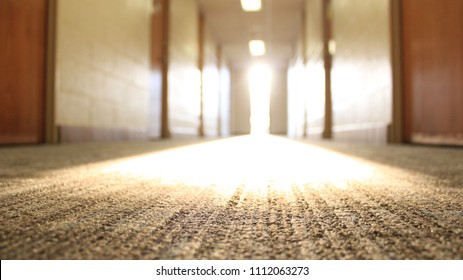 Close Up Focus On Light Rays Down A College Dorm Hallway.