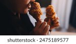 close up focus woman hand hold fried chicken for eat,girl with fast food concept