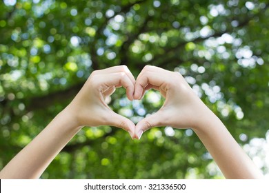 Close Up Focus Woman Hands Show Love Symbol On Green Nature Outdoor Park:heart Shape:happy Healthy Life And Avoid Illness Concept.