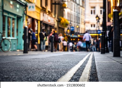 Close focused low street view of London's West End shops and people