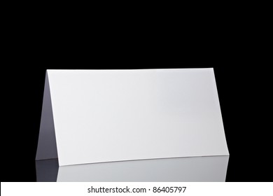 Close Up Of  A Folded Card On Black  Background  With Clipping Path