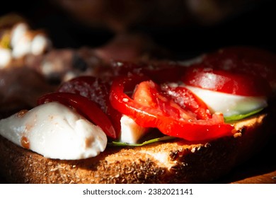 Close up of food with grated cheese, mushrooms and tomato under the morning sunlight. - Powered by Shutterstock