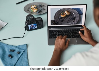 Close Up Of Food Photographer Editing Pictures Using Laptop In Studio, Copy Space