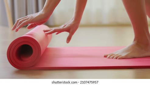 Close Up Foot Of Asian Woman Is Rolling Pink Yoga Mat And She Preparing To Do Exercise Or Meditation Activity