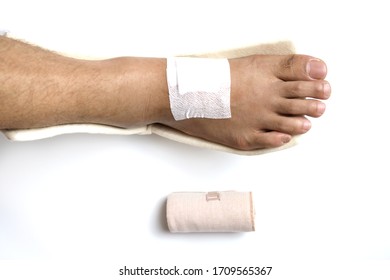 Close Up   Foot With Medical Plaster And Soft Splint  Caused By Accidents. 