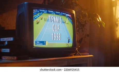 Close Up Footage Of A Dated TV Set Screen With Live Sports Tennis Match Broadcast. Two Athletic Female Players In Staged World Cup 1998. Nostalgic Retro Nineties Technology Concept.