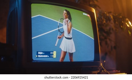 Close Up Footage Of A Dated TV Set Screen With Live Sports Tennis Match Broadcast. Athletic Female Player In White Scores A Goal. Nostalgic Retro Nineties Technology Concept.