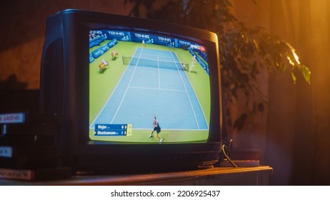 Close Up Footage Of A Dated TV Set Screen With Live Sports Tennis Match Broadcast. Two Athletic Female Players In Staged World Cup 1998. Nostalgic Nineties Technology Concept.