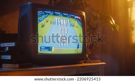 Close Up Footage of a Dated TV Set Screen with Live Sports Tennis Match Broadcast. Two Athletic Female Players in Staged World Cup 1998. Nostalgic Retro Nineties Technology Concept.