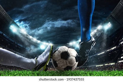 Close up of a football action scene with competing soccer players at the stadium - Shutterstock ID 1937437555