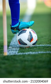 Close Up Football Player Holding Ball Under His Foot